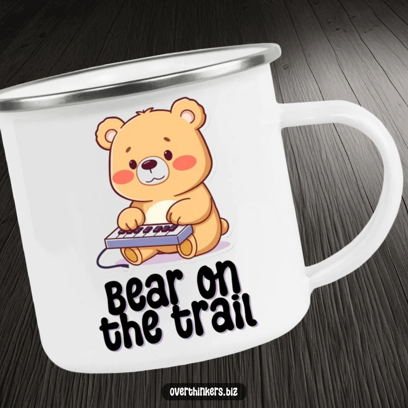 Funny cheerful bear furiously typing on a miniature keyboard, printed on a sturdy enamel camping mug.