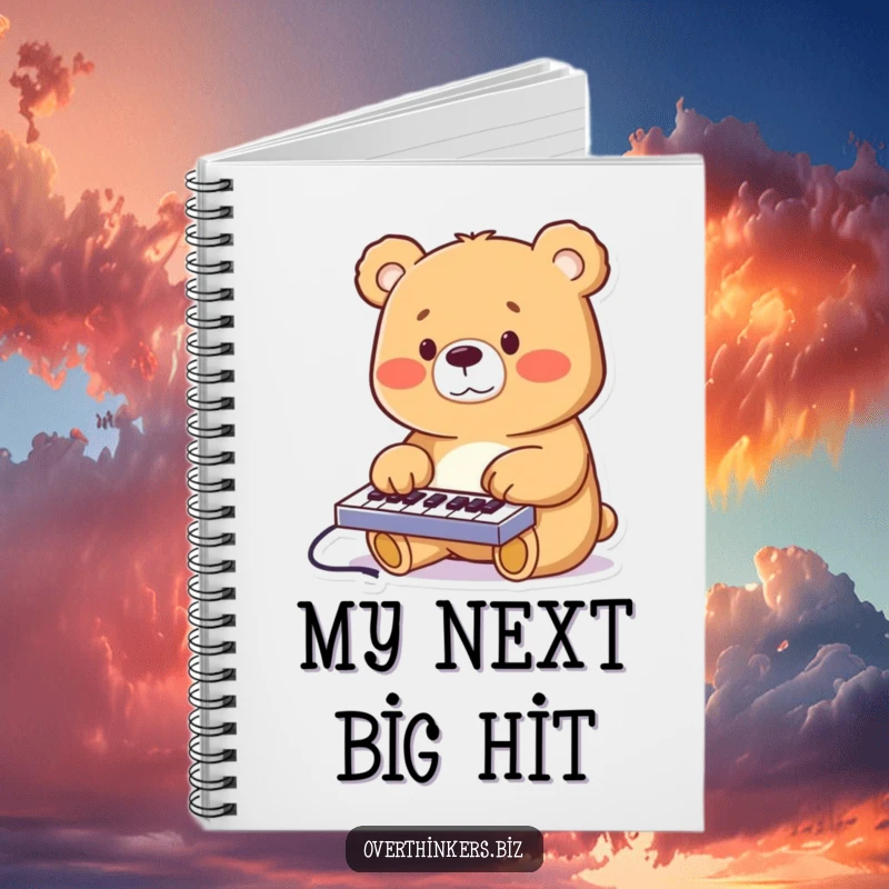 Funny cheerful bear furiously typing on a miniature keyboard, on the cover of a lined notebook.