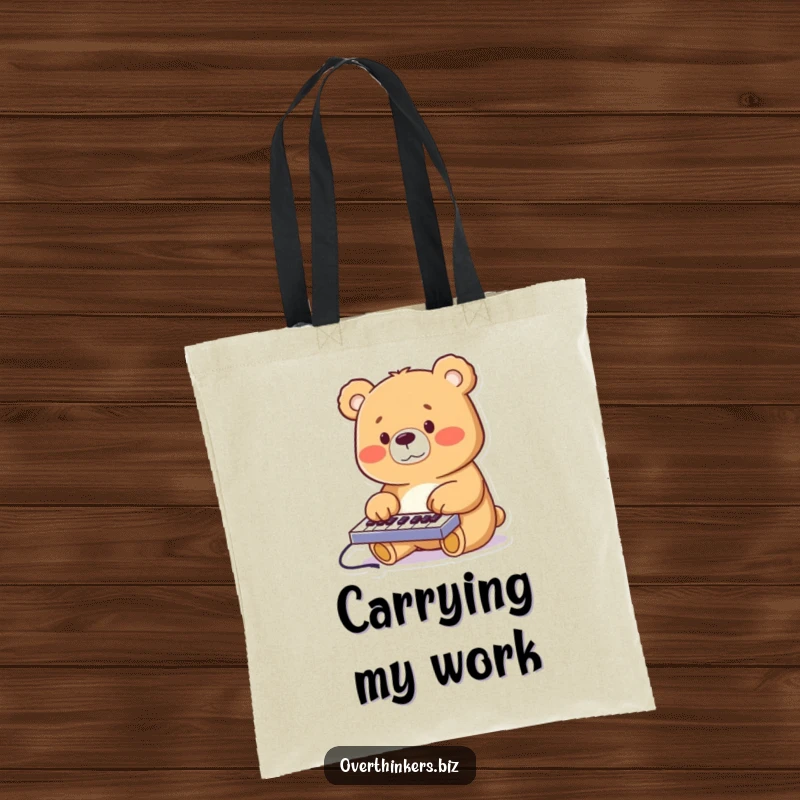 Funny cheerful bear furiously typing on a miniature keyboard with its paws, printed on a durable tote bag.